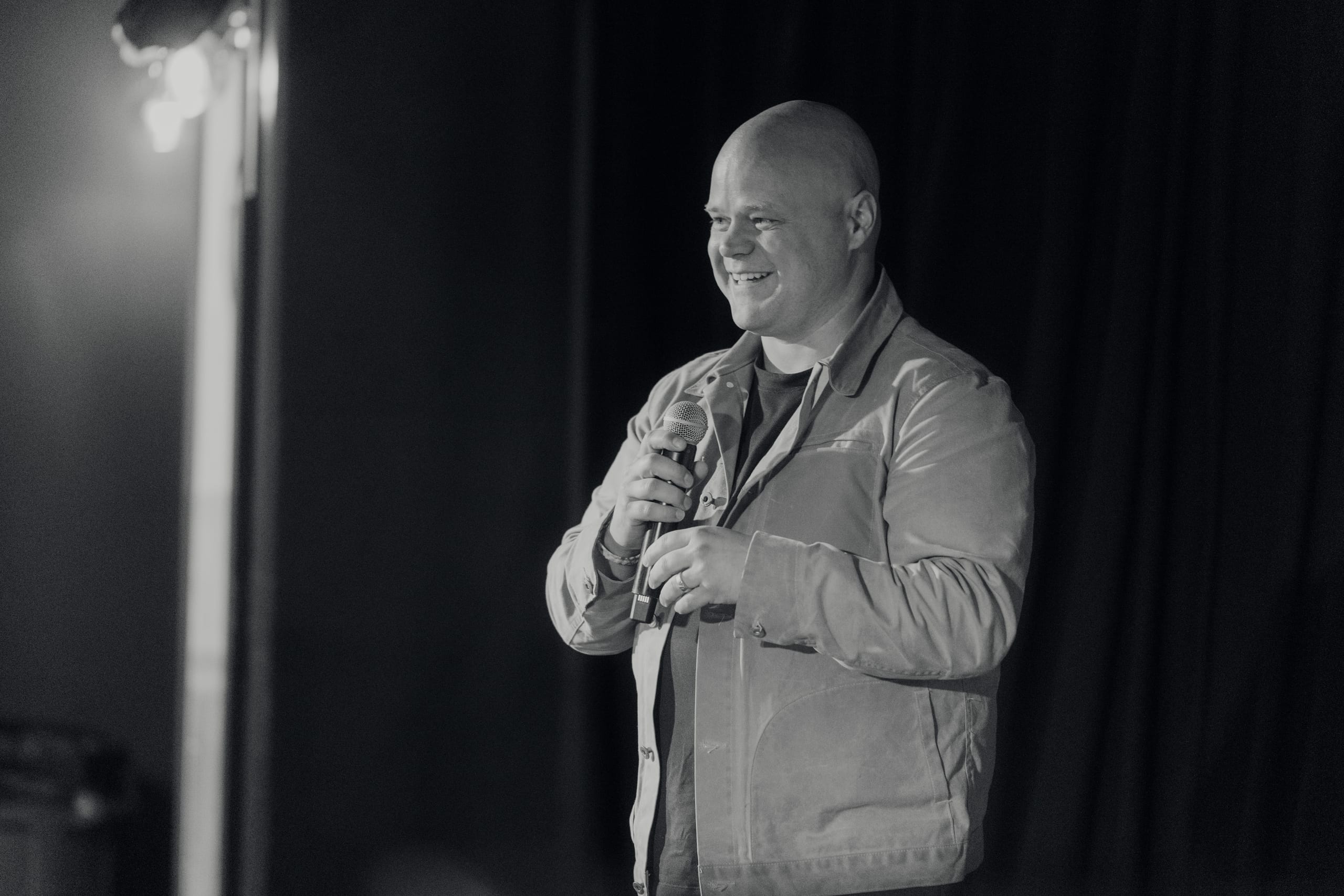 Matt Ramage speaking on stage about showing up authentically on camera